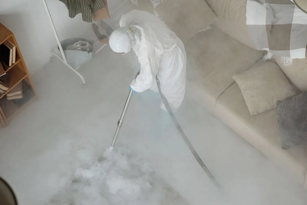 Biohazard cleanup technician in protective equipment, Stanley, VA